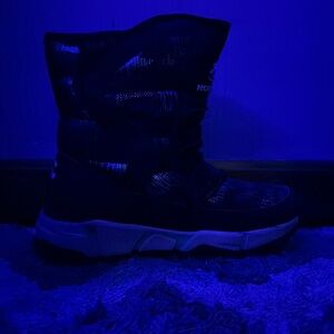 These are nice boots white soft fur in the inside good for playing in the snow